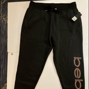 Bebe joggers NWT black with golden rhinestud logo, soft fleece lining